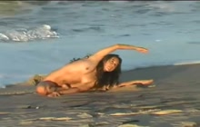 Nude yoga on the public beach